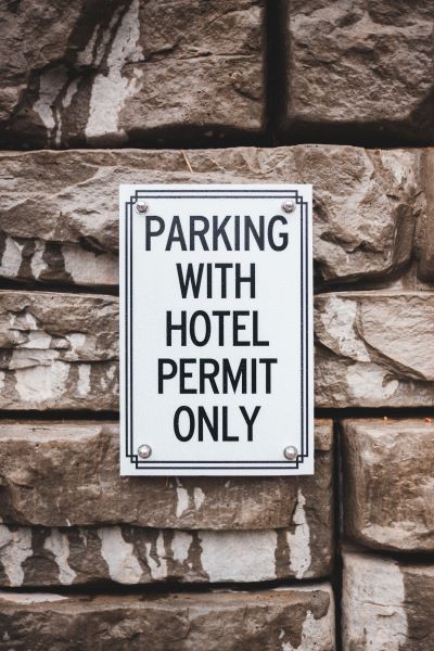 Parking sign, business plan discusses licenses Parking sign, business plan discusses licenses