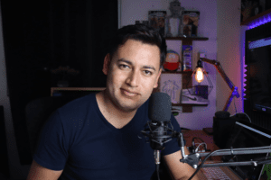 Young man preparing to record a podcast in his studio